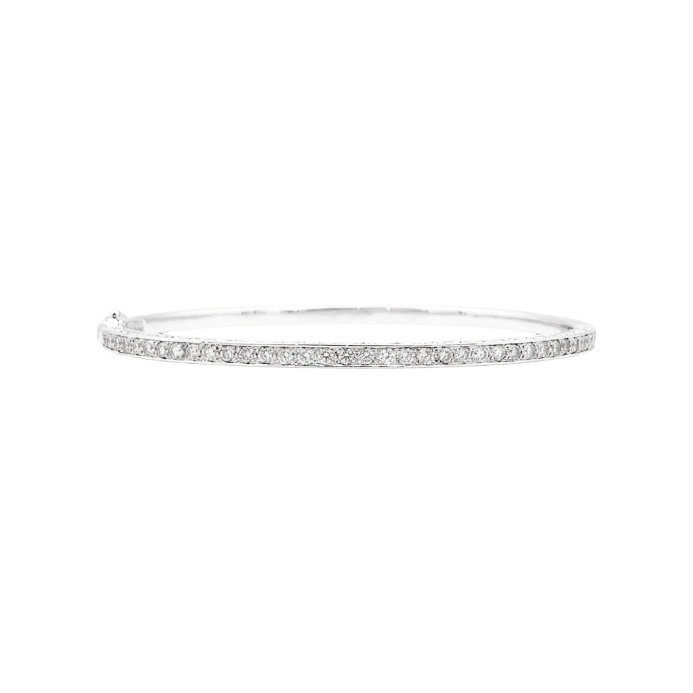 Bracelet jonc, or blanc et diamants.