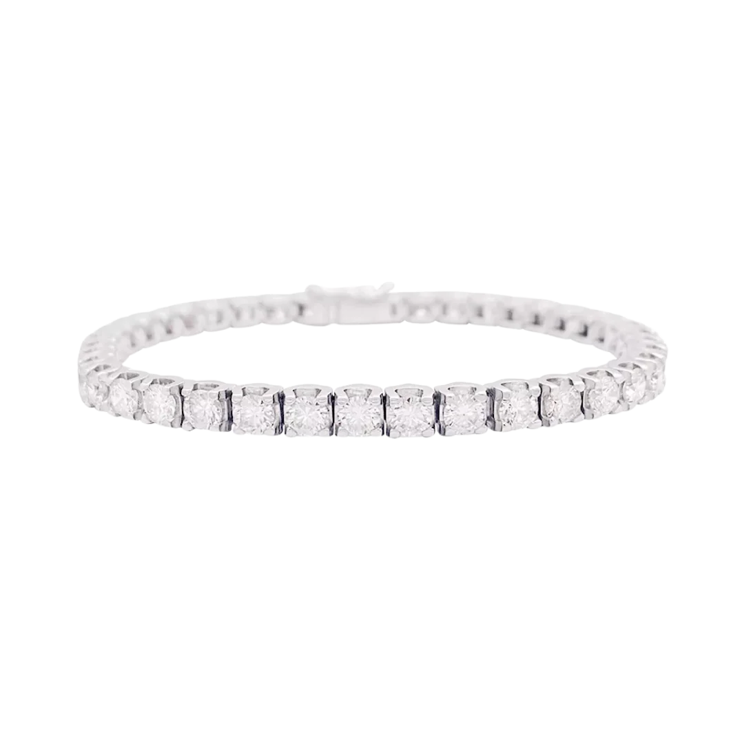 Ligne tennis or blanc diamants.